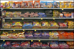 Bags of candy line Rite-Aid's shelves.