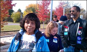 Josephine Huyghe, 84, stands in line near Renaissance High School in Detroit for a campaign appearance by former President Bill Clinton.
