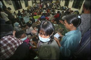 Villagers who live on the slope of Mount Merapi gather at a temporary shelter in Pakem, Yogyakarta, Indonesia.