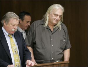 Thomas Wineinger, right, standing with public defender James MacHarg, is arraigned on drug charges Wednesday in Toledo Municipal Court.