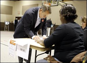 U.S. Rep. John Boehner signs in before casting his vote in West Chester, Ohio. The Ohio Republican is likely to become speaker of the House with his party's regaining a majority of seats in the midterm elections. All 435 House seats were on the ballot.