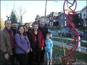 From left, Duane Rodriguez-Winter, Javier Rodriguez-Winter, Magdelena Steiner, Maria Rodriguez-Winter, Thelma Rodriguez-Winter, Barbara Winter, and artist Richard Mauere with his daughter Samantha at the sculpture dedication.