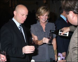 Nick Kubiak, left, of The Andersons, and Susan Hilton sample the fare at Meals on Wheels' 23rd annual Wine Gala on Nov. 6 in the Stranahan Great Hall.<br>
<img src=http://www.toledoblade.com/graphics/icons/photo.gif> <font color=red><b>PHOTO GALLERY: </b></font><a href=