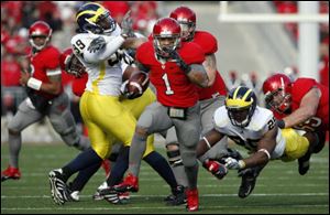 Ohio State's Daniel Herron breaks loose for a touchdown in the third quarter. He rushed for a game-high 175 yards. He also had a 98-yard touchdown cut down to an 89-yard run because of a holding penalty. 