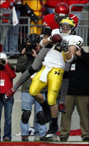 Clay graduate Jordan Kovacs intercepts a pass intended for DiVier Posey. Kovacs also had 17 tackles.