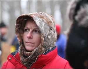 Mary Alcock, a neighbor of Mr. Skelton, joins other searchers at Riverside Natural Area in Morenci.