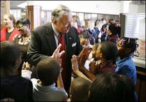 CTY sherman15p 12/15/10  The Blade/Dave Zapotosky Blade general manager Joe Zerby congratulates students from Sherman Elementary School in Toledo after they sang Christmas carols at The Blade, Wednesday, December 15, 2010.