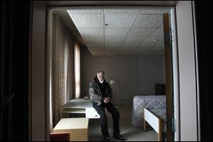 Peter Hatas, a former engineer who is homeless, sits in one of the rooms  in the building he hopes to rehab just north of downtown.  Mr. Hatas sleeps in his van and eats at local soup kitchens.