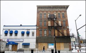 Two properties on the corner of Lagrange and N. Summit that Peter Hatas, a homeless engineer who holds at least a couple of patents, hopes to make into a homeless-helping-the-homeless project.