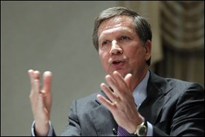 Gov. John Kasich speaks to an audience of more than 300 at a joint session of the Toledo Regional Chamber of Commerce and the local Rotary Club.