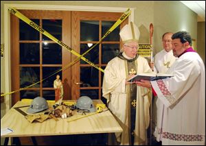 Bishop Leonard Blair blesses an area at Sacred Heart Home for the Aged in Oregon that is being renovated into a nursing home room by the Little Sisters of the Poor.