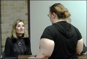 Susan Lang, Rossford school superintendent, speaks with Heather Heffran, whose 10-year-old son is in the fourth grade at Glenwood.