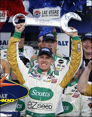 Carl Edwards celebrates his NASCAR Sprint Cup victory at Las Vegas Motor Speedway Sunday. It was his first win of the season.