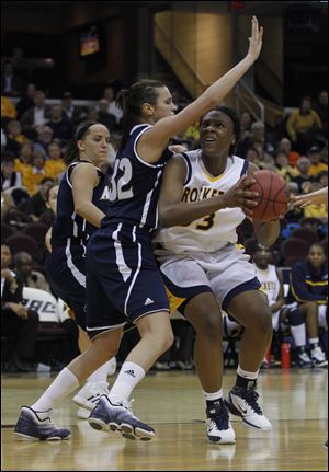 Toledo's Yolanda Richardson, right, tries to get around Akron's Rachel Tecca. Richardson had 10 points and nine rebounds.