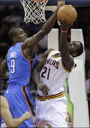 Oklahoma City's Serge Ibaka blocks the shot of J.J. Hickson. Hickson had 15 rebounds.