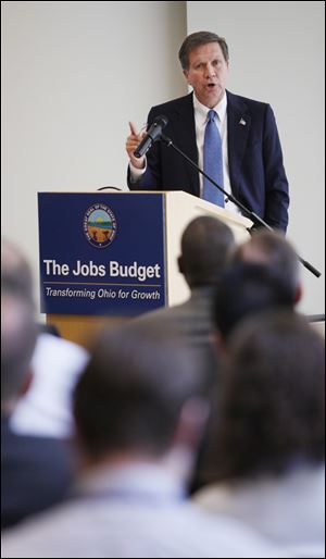 Ohio Governor John Kasich introduces the newly proposed budget during a press conference in the Riffe Center in Columbus.