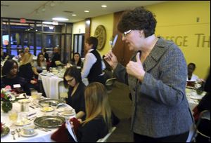 Bonnie Bland of Aladdin Food Management Services teaches students
how to make a good impression during business meals.