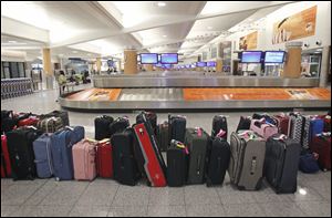 Higher fuel costs are being cited by some U.S. airlines for raising checked-bag fees, given that oil has surpassed $100 a barrel.