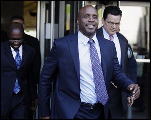 Former baseball player Barry Bonds leaves the federal courthouse for his perjury trial in San Francisco,  Thursday.