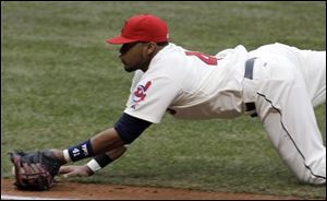 Cleveland first baseman Carlos Santana catches a sacrifice bunt hit by Chicago's Alexei Ramirez in the fourth inning Sunday. The catch began a triple play.