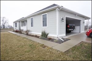 Erie Township resident Joe Bodi, 78, was attacked in his home, shown, by masked gunmen.