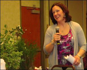 Jenn Amstutz, store manager of Nature's Corner at Glass City Landscape, gives a gardening presentation to those gathered at the Toledo Symphony League's annual Rite of Spring luncheon.