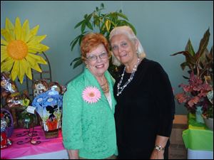 Rusty Phlegar, left, and Helen Rogge attend the Toledo Symphony League's Rite of Spring luncheon at the Toledo Hilton.