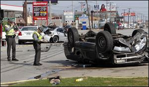 Authorities respond to a three-vehicle crash on Monroe Street just east of Whiteford Road in Sylvania Township. The Toledo post of the Ohio Highway Patrol said three people were hurt about 4 p.m. Sunday when a westbound pickup struck a car and flipped. The eastbound car was hit from behind by another car. Each car had one person, the drivers, who had nonlife-threatening injuries, officers said. Two were taken to Toledo Hospital and the third went to Flower Hospital.