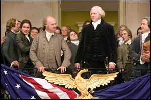 Paul Giamatti, center left, plays the role of John Adams, the first U.S. vice president and the nation's second president, next to David Morse as George Washington, in the HBO miniseries 