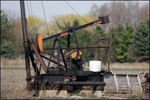 This oil pump jack near Bowling Green is still in operation and is within the Lima-Indiana Field, which stretches across Lucas, Wood, Hancock, Allen, and Van Wert counties in Ohio and into northeastern Indiana.