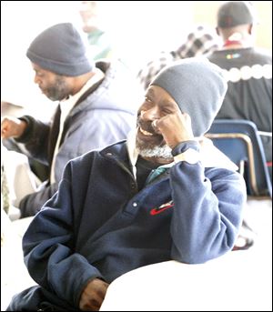 Robert Thompson pauses to relax during the Easter lunch gathering. Volunteers served more than 100 people at the Madison Food Service and Community Center. 