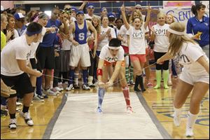 Seniors Nick Bombalicki, left, and Shannon Kirkwood, right, pull teammate Alekx Todorov during the spirit games.