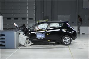 The 2011 Nissan Leaf, which runs solely on battery power and has a range of around 100 miles, undergoes a front-end crash test, part of the series  performed by the Insurance Institute for Highway Safety.