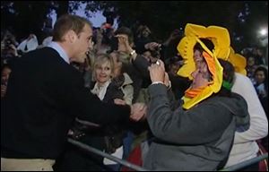 Prince William, left, greets well-wishers gathered along the wedding processional route in central London Thursday. The prince, second-in-line to the British throne, was set to marry commoner Kate Middleton today in Westminster Abbey.