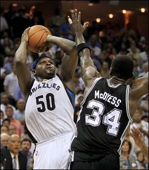 Grizzlies forward Zach Randolph (50) shoots against Spurs forward Antonio McDyess (34) during the second half.