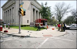 An ambulance rammed into an Old West End church Wednesday afternoon after an accident with a car at a nearby intersection.