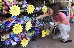 Stacey Robin shops for discounted ribbons Wednesday at a Michaels store in Santa Clarita, Calif. 