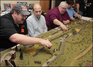 Ted Bender, of Adrian, Dave Nelms, of Toledo, Marc Moralez, of Toledo, and Matt Horst, of Temperance, play Gettysburg Soldiers.