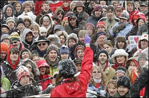 urse Angela Aldous rallies protesters during demonstrations outside of the state Capitol in Madison, Wis., in this Feb. 26 file photo.