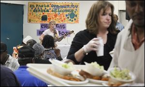 Crystal Bowersox performed for diners at St. Paul's Community Center after helping to serve lunch.