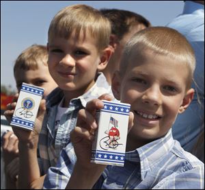 The Borowski brothers, from left, Cooper, Spencer, and Blake, of Whitehouse, got the President’s autograph on their boxes of M&M’s.