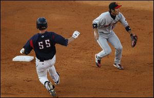 The Hens' Ryan Strieby makes it to second base as Rochester short stop Tsuyoshi Nishioka waits for the throw.