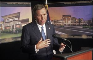 Gov. John Kasich speaks on the details of an agreement between Rock Ohio Caesars and the state of Ohio on the building of casinos in Cincinnati and Cleveland on Wednesday at a news conference in Cincinnati.