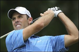 Charl Schwartzel shot a 68 and is three shots behind. Schwartzel won the Masters when Rory McIlory collapsed in the fourth round.