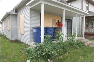 Montelle Taylor lived in this house at 1338 Grand Ave. for more than a year. It hasn’t had water or gas service since October, 2009, according to Toledo’s utilities department and Columbia Gas.