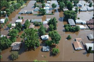 A  Minot, N.D., neighborhood is submerged Thursday by flood water from the Souris River.