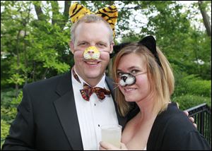 Ian Hartten and Lisa Reichert sport animal noses during ZOOtoDO at the Toledo Zoo.