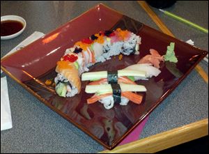 The rainbow roll, top, and the California Sashimi at Asian Grill.