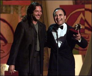 Tomatito, left, and Michel Camilo accept the award for best Latin jazz album for 