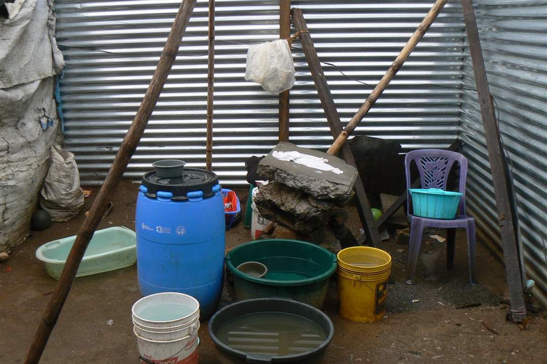 Guatemala-ghetto-water-drum